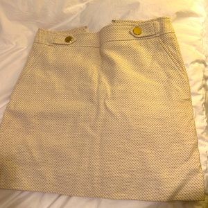 Ann Taylor size 4 winter white mini skirt with gold buttons. In great condition